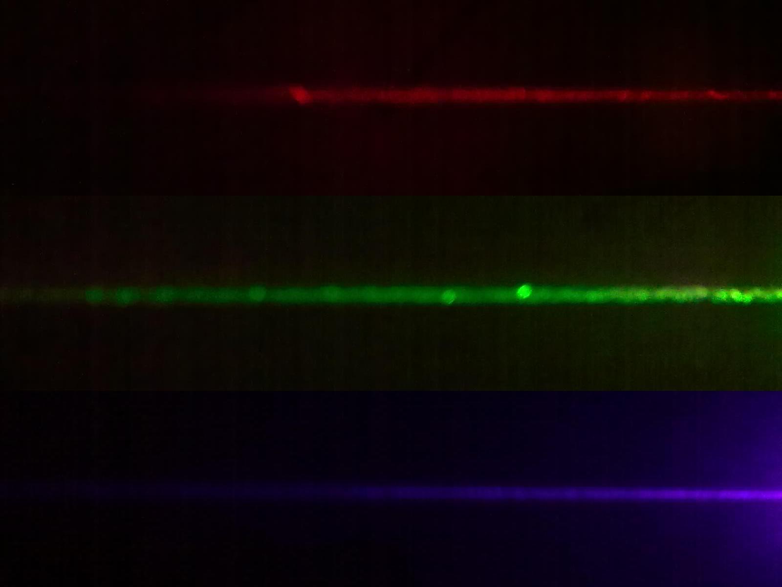 Laser pointer beams red green violet